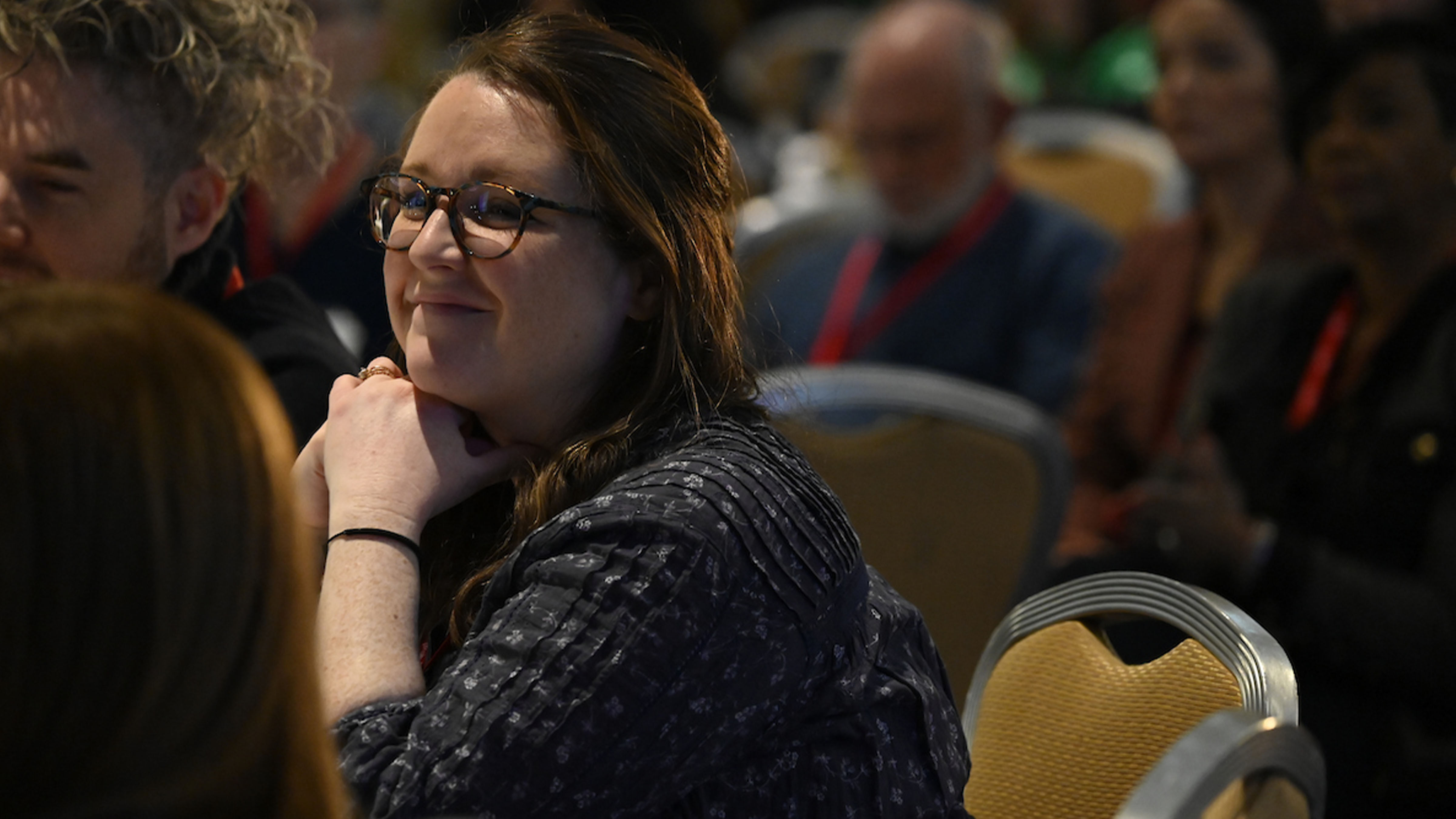 A conference attendee engaged in the programming at Net Inclusion.